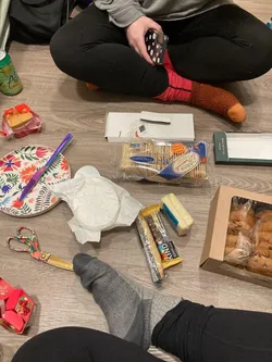 Photo of various items strewn about a carpet floor