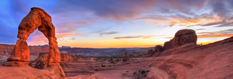 Sweeping sunset panoramic view of famous Delicate Arch in Arches National Park in Moab, Utah (HDR)