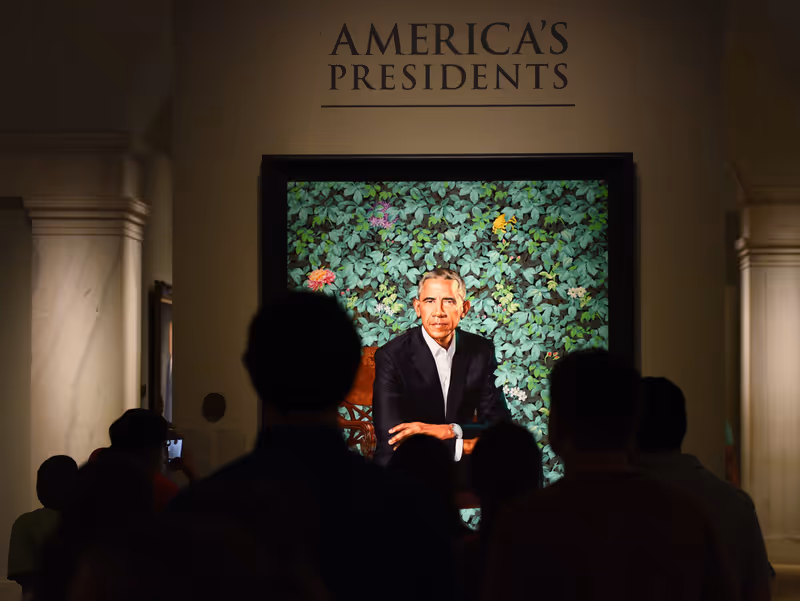 Washington, DC - June 01, 2018: People near the portrait of the 44th president of the United States Barack Obama by Kehinde Wiley in National Portrait Gallery in DC.