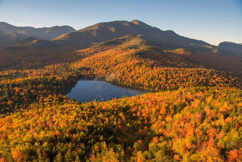 Morning light illuminates the fall color in the Adirondack mountains