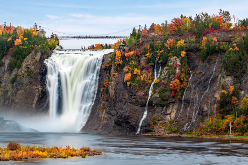 Montmorency Falls and Bridge in autumn with colorful trees