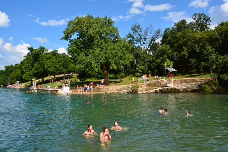 Austin, Texas, USA - June 12, 2015. Barton Springs Pool in Austin, TX, with people.