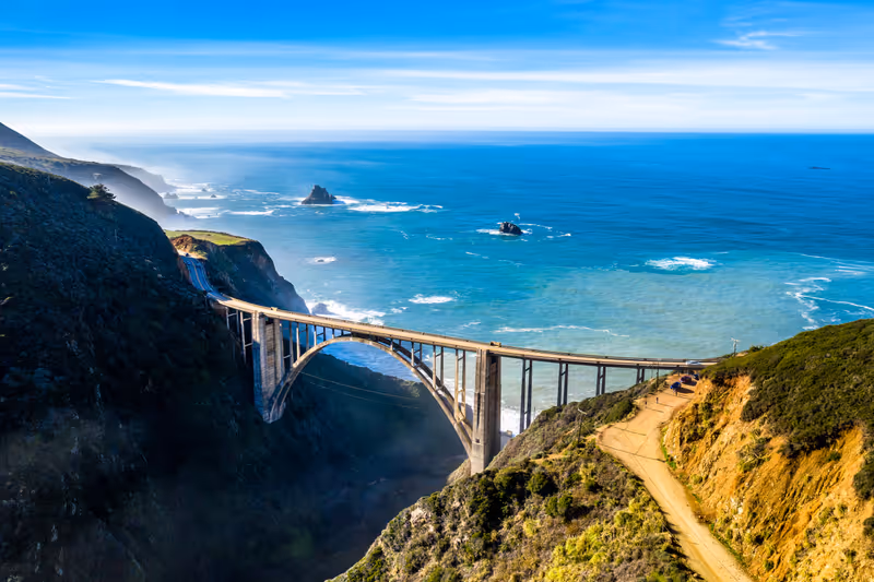 Aerial Bixby Bridge (Rocky Creek Bridge) and Pacific Coast Highway near Big Sur in California, USA America. Drone Shot