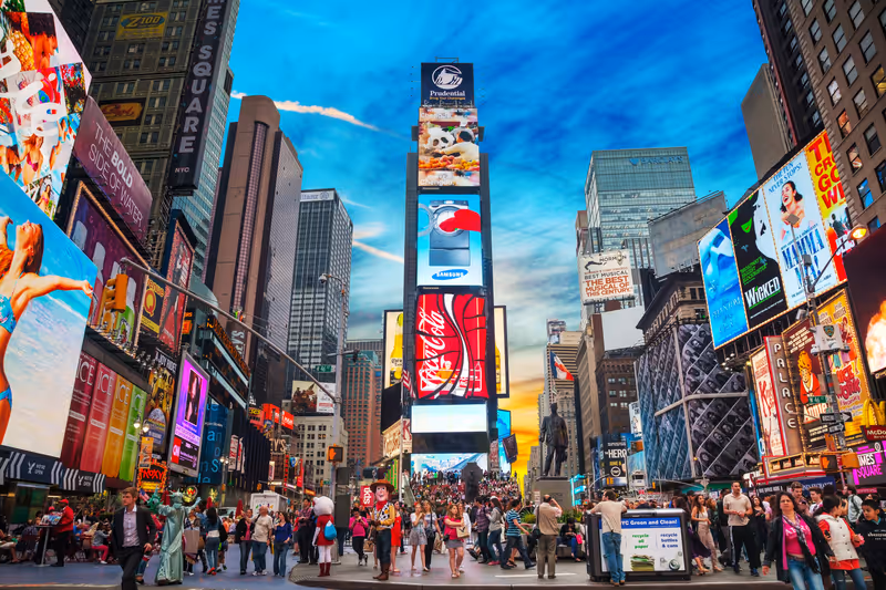 NEW YORK CITY - MAY 11: Times Square with tourists on May 11, 2013. Iconified as "The Crossroads of the World" it's the brightly illuminated hub of the Broadway Theater District.953