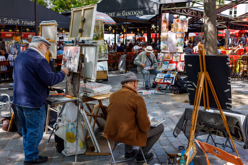 Artists paint and draw on the Place du Tertre, a square at the Butte Montmartre area in Paris, spring 2017