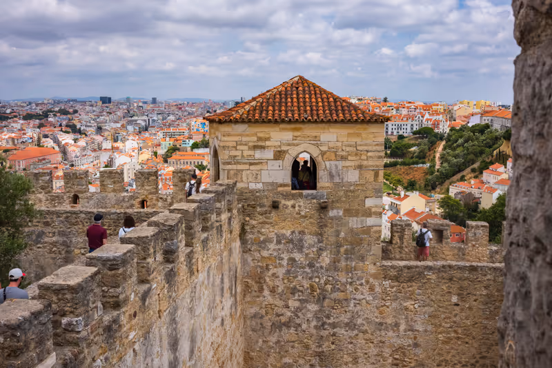 Lisbon/Portugal-July 1, 2018: Tourist explore the Castelo de S. Jorge and take in the views of unique architecture from the city's highest elevation.
