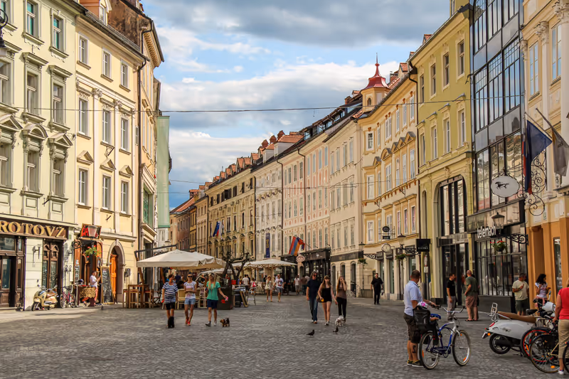 Ljubljana, Slovenia - July 16th 2018: Bars and cafes in Mestni Trg, Ljubljana City Square beside the town hall, on a summers day, Slovenia
