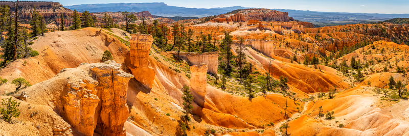 Hoodoos and eroded sandstone formations along the Queen's Garden and Navajo Loop hiking trails at Bryce Canyon National Park in Utah.