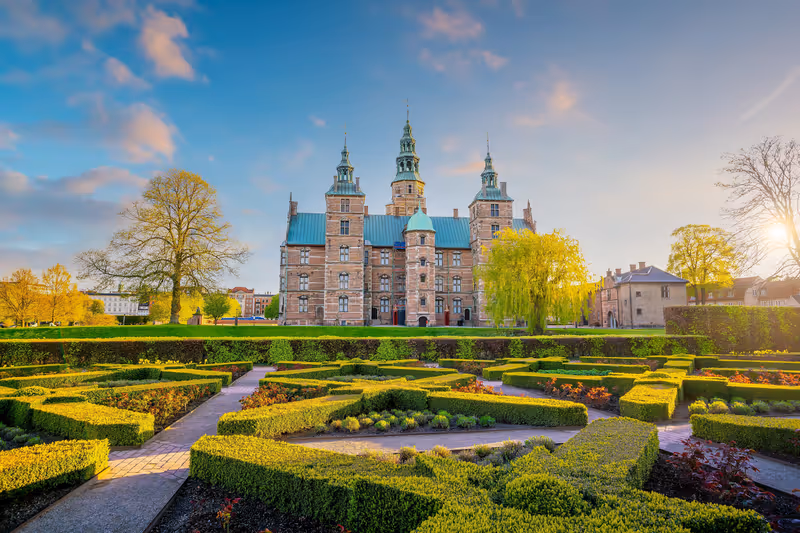 Rosenborg Castle Gardens in Copenhagen, Denmark with blue sky