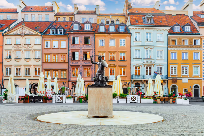 Warsaw, Poland - August 7th, 2021: Famous statue of the mermaid - official symbol of Warsaw city located in the centre of the Old Town Market Place