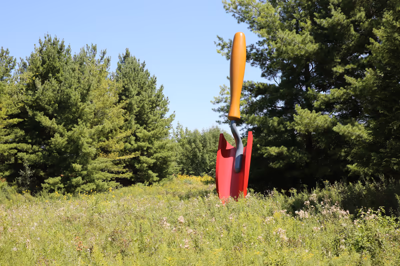 Grand Rapids, Mich, USA - Aug 14th 2021: Plantoir or Gardener's Trowel, sculpture by Claes Oldenburg and Coosje Van Brugge at Frederik Meijer Gardens and Sculpture Park