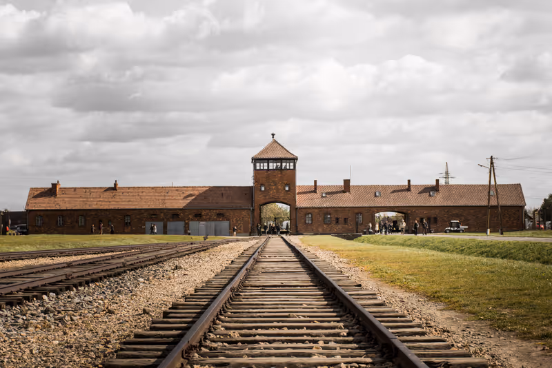 Oswiecim, Poland - November 7 2018: Train tracks leading up to main entrance, auschwitz-birkenau concentration camp.