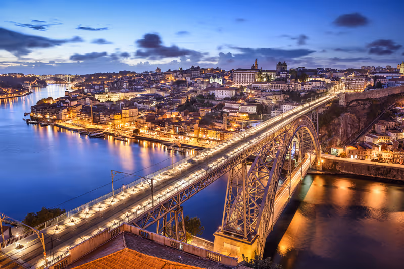 Porto, Portugal cityscape over the Douro River and Dom Louis Bridge.
