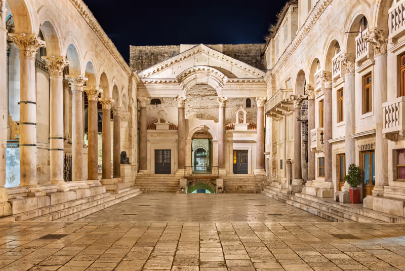 SPLIT, CROATIA - AUGUST 4: Diocletian's Palace on August 4, 2014 in Split. View of the peristyle of Diocletian's Palace in Split at night, an ancient palace built by the Roman emperor Diocletian
