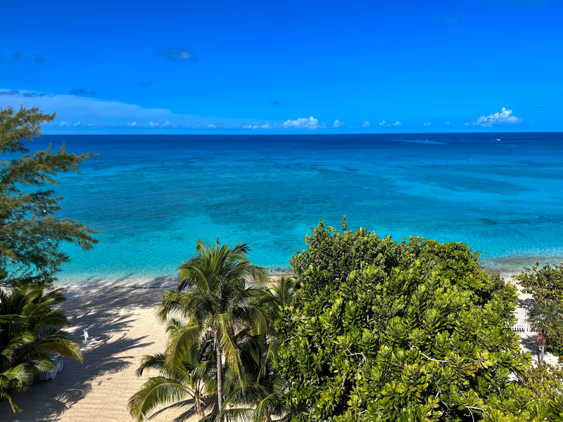 An aerial view of Cemetery Beach on Seven Mile Beach in Grand Cayman Island on a beautiful sunny day.