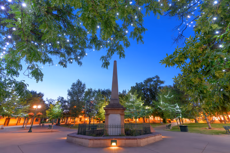 Santa Fe, New Mexico, USA in Santa Fe Plaza with the Soldiers' Monument at twilight.