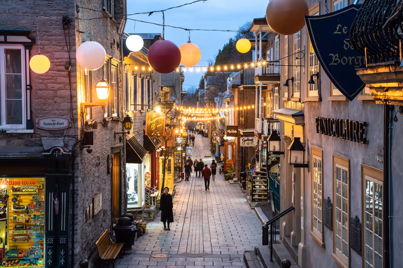 Quebec City, Canada - November 7, 2022:  View of historic lower Quebec City in Canada seen at night with people and lights