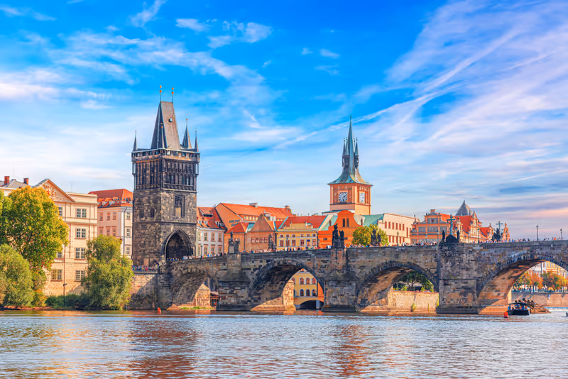 Prague - Charles bridge, Czech Republic. Scenic aerial sunset on the architecture of the Old Town Pier and Charles Bridge over the Vltava River in Prague, Czech Republic.