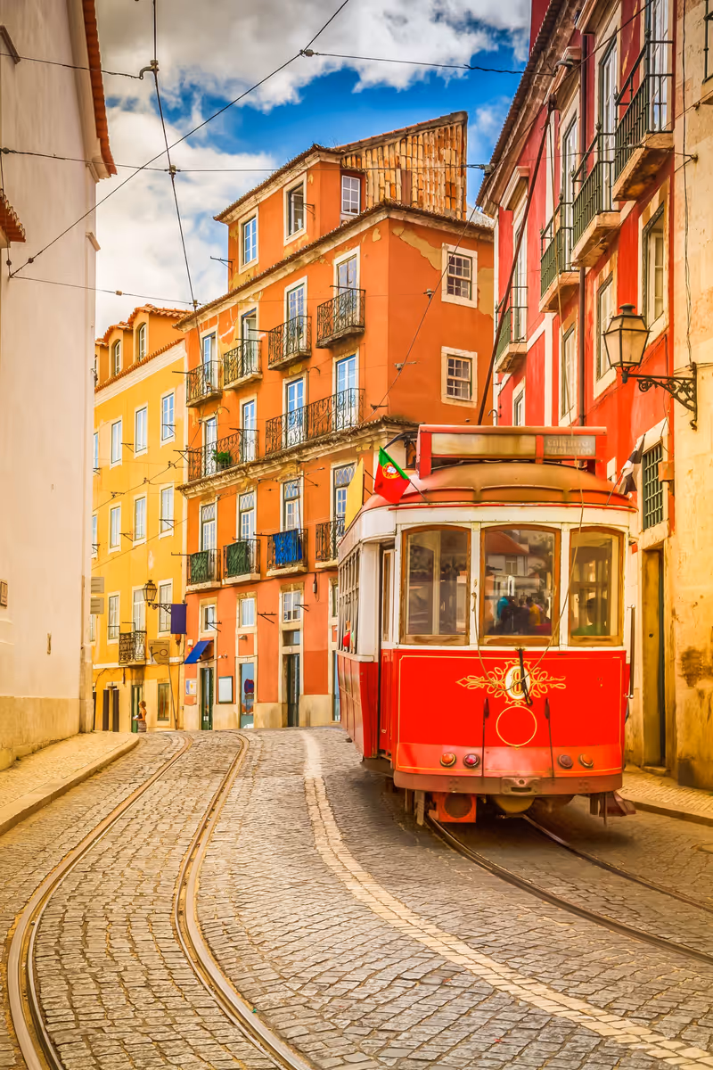 tram on narrow street of Alfama, Lisbon, Portugal