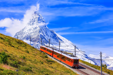 Zermatt, Switzerland. Gornergrat tourist train with Matterhorn mountain in the background. Valais region.