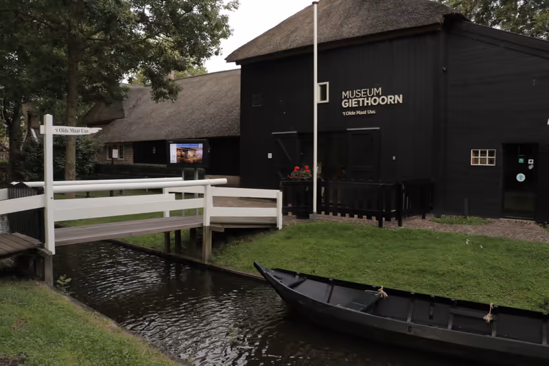 Giethoorn, The Netherlands - July 23 2023: Horizontal photo of signs on the outside of the building of the museum in Giethoorn called 'Olde maat uus'. Captured with selective focus.