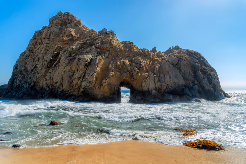 Keyhole Arch at Pfeiffer Beach California landscape in sunny summer day, Big Sur, California.