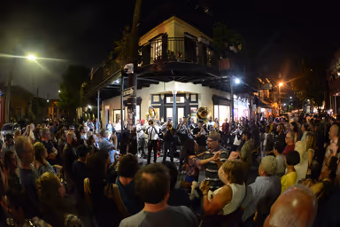 New Orleans, LA - April 28, 2017: A local brass band plays on a street corner at Frenchmen Street.