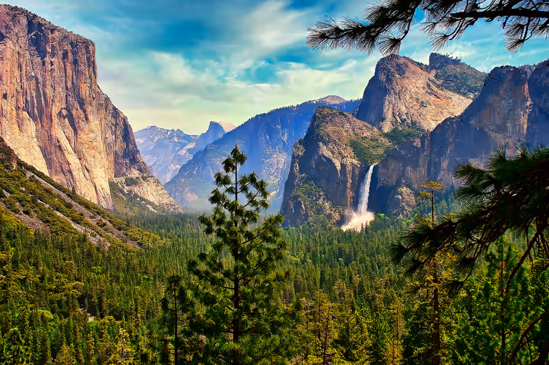 A panoramic view of the iconic Yosemite Valley in the Springtime, showing Bridalveil Falls and El Capitan.