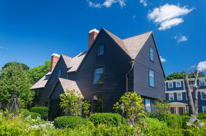 A flower garden at the house of the seven gables in Salem Massachusetts on a sunny day.