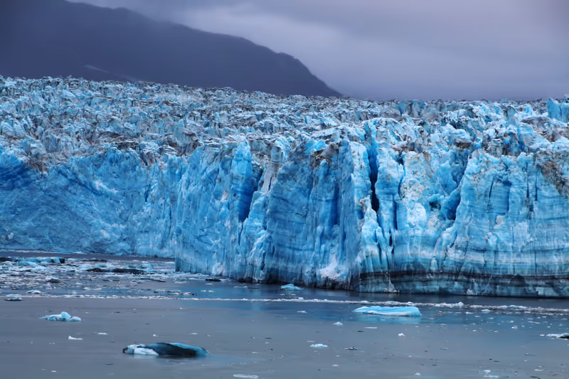 Alaska, Hubbard Glacier emerges from the morning fog, United States