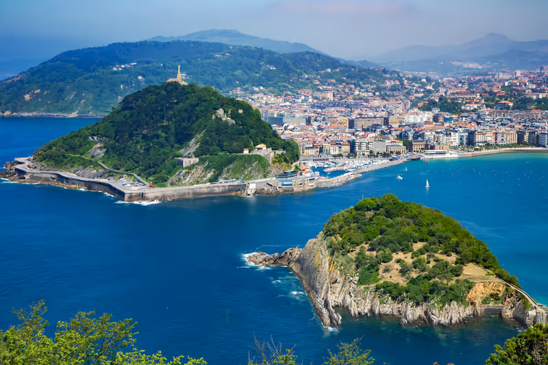 SPAIN, SAN SEBASTIAN, MAY, 10, 2018: View from mount Igueldo to mount Urgull and Santa Clara Island of the Bay of Biscay, San Sebastian, Donostia, Spain