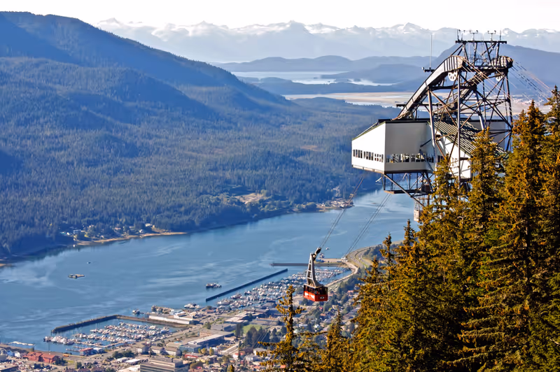 The red tram car of the Goldbelt Mount Roberts Tramway climbs 1800 ft. above Juneau, Alaska