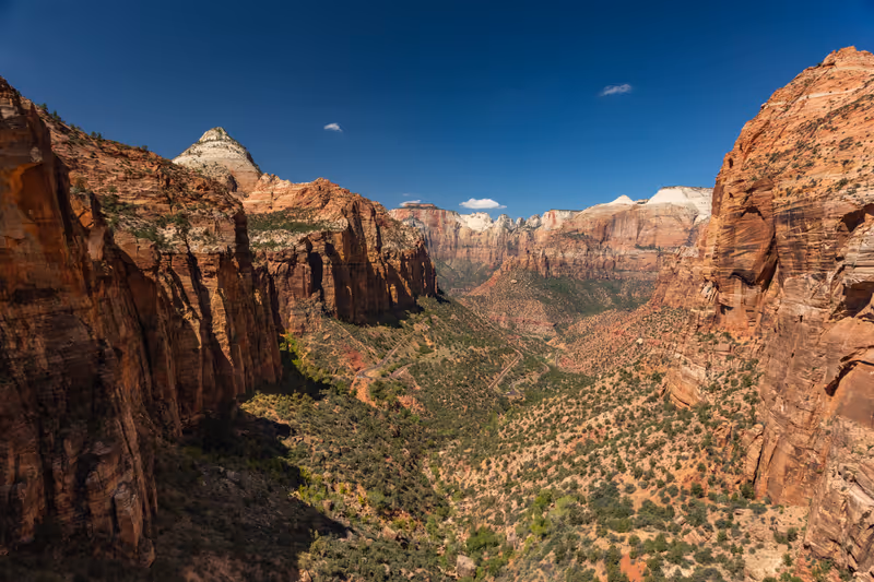 Panoramic View from the Canyon Overlook Trail into scenic Zion National Park on a perfect Summer Day with blue Sky