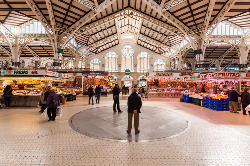 VALENCIA, SPAIN - FEBRUARY 10, 2015: market hall Mercado Central with unidentified people. Built in architectural style of Modernisme its considered one of the oldest European markets still running