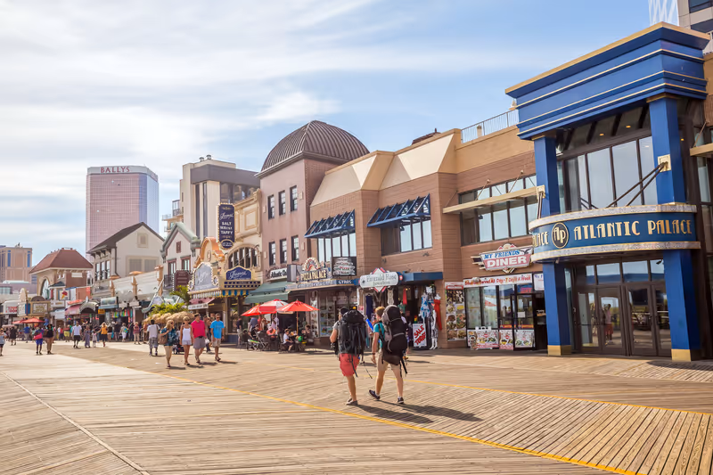 ATLANTIC CITY, NEW JERSEY - August 3: The boardwalk and Casinos on August 3, 2015 in Atlantic City, New Jersey. Gambling was legalized in the city in 1976 and led to a resurgence.