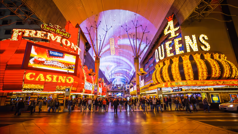 LAS VEGAS, NEVADA - FEBRUARY 5: Bright neon lights and tourists at the Fremont Street Experience in Las Vegas, Nevada on February 5th, 2016.