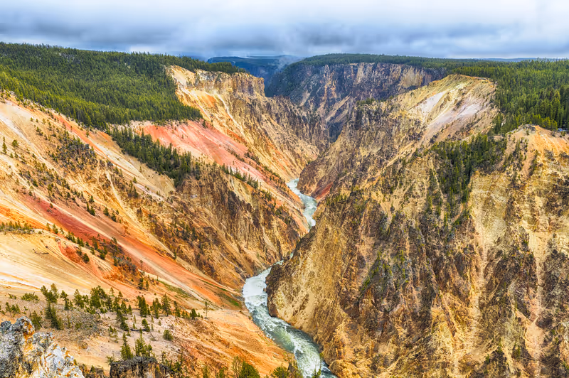 View at a vivid Grand Canyon of the Yellowstone and Yellowstone river seen from Artist Point. Yellowstone National Park, Wyoming, USA