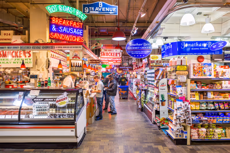 PHILADELPHIA, PENNSYLVANIA - NOVEMBER 18, 2016: Vendors and customers in Reading Terminal Market. The historic market is a popular attraction for culinary treats.