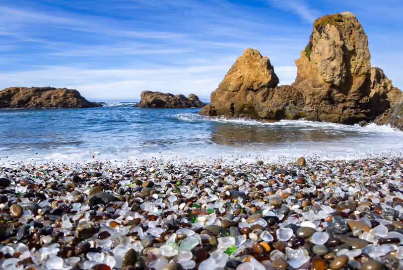 colorful glass pebbles blanket this beach in Fort Bragg, the beach was used as a garbage dump years ago, nature has tumbled the glass and polished it making it a tourist destination