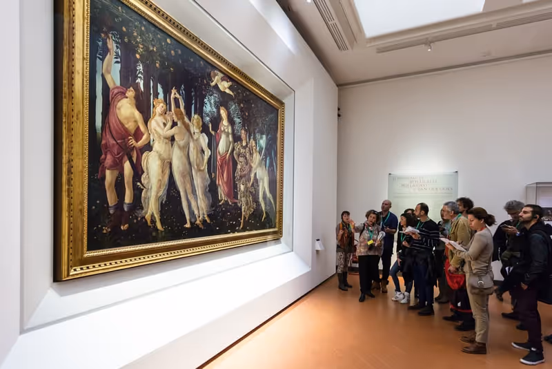 FLORENCE, ITALY - NOVEMBER 5, 2016: visitors in Botticelli hall of Uffizi Gallery. The Uffizi is one of the oldest museums in Europe, its origin refers to 1560, when Vasari designed large palace