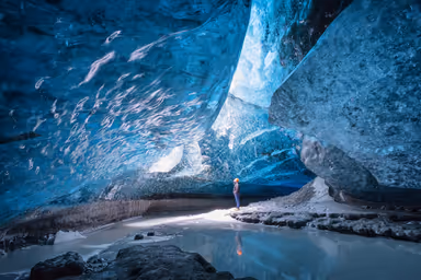 Vatnajokull, Iceland -10 MARCH, 2014: A man standing in Vatnajokull ice cave.