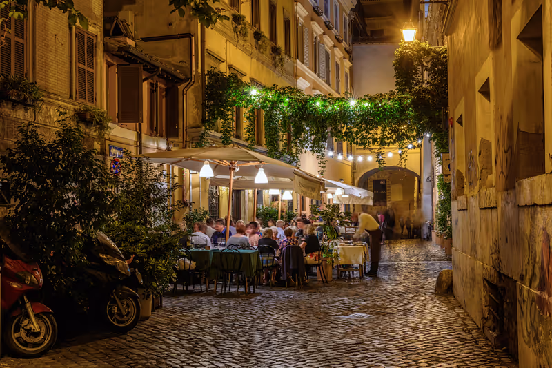 Night view of old cozy street in Trastevere in Rome, Italy. Trastevere is rione of Rome, on the west bank of the Tiber in Rome, Lazio, Italy. Architecture and landmark of Rome